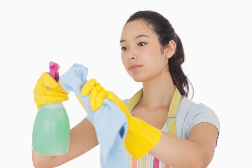 Cleaner washing shopfront windows in Twickenham