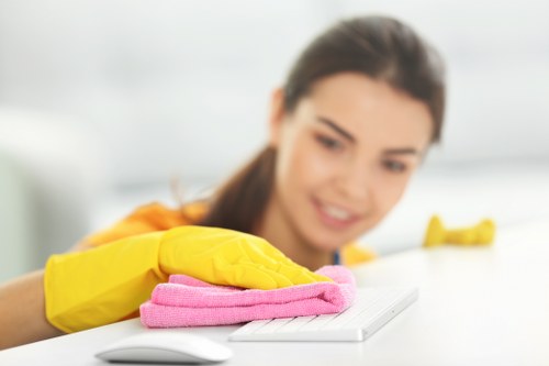 Technician handling approved cleaning chemicals with care