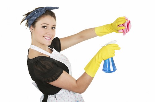 Local cleaner working in a Twickenham block with narrow stair access