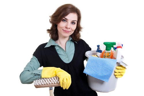 Cleaner setting up a safe work area and warning signs